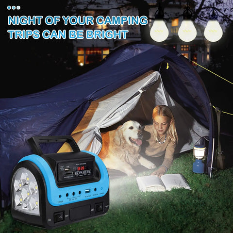 Beefy All In One Portable Solar Power Station With Panel And Built-In LED Lights next to a tent with a girl and dog at night