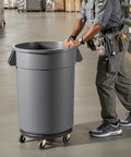Heavy Duty Trash Can Dolly For 20 32 44 And 55 Gallon Bins Two Pack with smooth swivel wheels, rolling a gray bin in a warehouse setting.