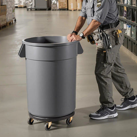 Heavy Duty Trash Can Dolly For 20 32 44 And 55 Gallon Bins Two Pack with smooth swivel wheels, rolling a gray bin in a warehouse setting.