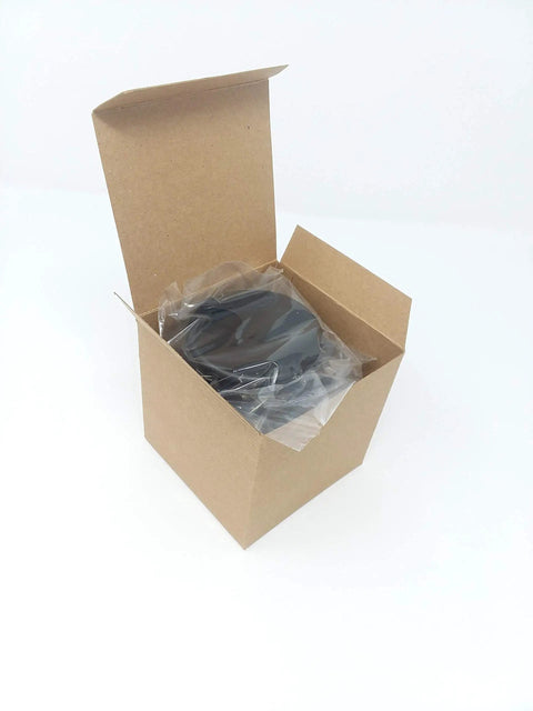 Heavy Duty Desk Grommet Covers For 2.5 Inch Cutouts Slick Black Plastic Cable Management Kit in a box, ready to install.
