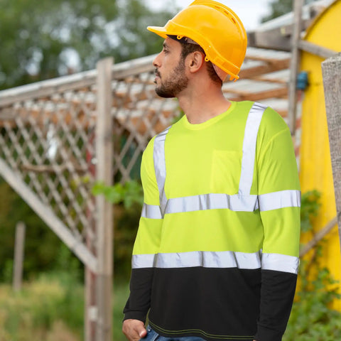 Worker wearing 6 Pack Class 3 High Visibility Long Sleeve Safety Shirts With Reflective Strips And Pocket Wicking Breathable Hi Vis Workwear For Construction Roadwork Outdoor Jobs Yard Crew Size XL in an outdoor setting