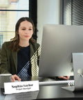 Woman at desk using computer with Pack Of 18 Clear Acrylic Desk Name Plates 2 By 8 Inches Blank Customizable Horizontal Slant.