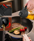Smooth Operator Sixteen Oz Glass Olive Oil Spray Bottle With Dual Pour And Sprayer Function Drip Free Build For Grilling Roasting And Healthy Cooking Bpa Free Matte Black Kitchen Ace dispensing oil over a skillet with vegetables.