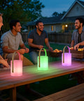 Outdoor gathering with Cordless LED Lantern Table Lamp With Remote, IP44 shower safe, RGB and warm white dimmable modes on table