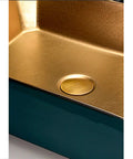Close-up of Top Shelf Ceramic Vessel Sink For Bathroom Countertops, featuring a gold interior and drain hole.