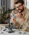 Man assembling 3D Metal Model Kit For Adults And Teens Into Military Helis And Fighter Jets, DIY Brain Teaser Puzzles