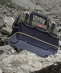 17 Inch Tool Bag For Men With Wide Mouth And Waterproof Molded Base Plastic Padded Handle Adjustable Shoulder Strap on rocks