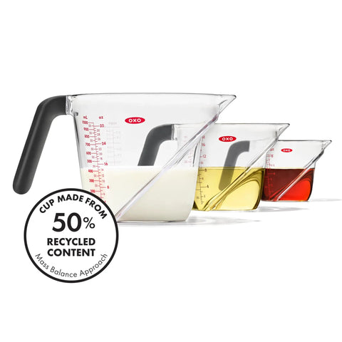 Angled 3 Piece Measuring Cup Set With Read From Above Design Liquid Measuring Cups for Easy Pouring, shown with colored liquids