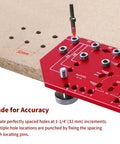 Pro Level 7 Hole Shelf Pin Jig And 2 In 1 Cabinet Hinge Boring Guide Set With Tough Steel Drill Bits For No Sweat Carpentry Work And Sweet Finish Furniture Builds That Bang For Your Buck, red aluminum jig showing precise hole locations on wood.