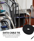 Reusable Black Cord Straps For Zero Fuss Cable Management And Electrical Wiring Featuring Heavy Duty Self Adhesive Backing securing messy cables.