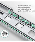 Close-up of stainless steel drawer slides with soft close and full extension, showing smooth glide mechanism and steel balls.