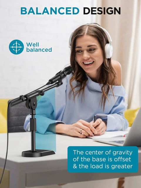 Woman using Adjustable Desk Microphone Stand With Weighted Base And Soft Grip Twist Clutch Boom Arm Three Eighths Inch And Five Eighths Inch Threaded Mounts Compatible With Blue Yeti And Blue Snowball Great For Kick Drums And Guitar Amps Black at desk with headphones.