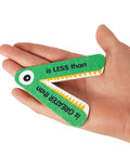 Greater Than Or Less Than Gator Mouth Math Manipulatives Set Of 12 for Grades K-3 Ages 5-8 in hand, green chipboard material.