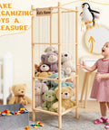 Large Wooden Stuffed Animal Storage Zoo Organizer With Toys Tray 57 Inch Tall For Plushies Extra Large Capacity Holds 50 Plus Plush Toys Perfect For Toddler Rooms Playrooms And Bedrooms featuring a child organizing toys.