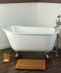 Retro clawfoot tub with chrome fixtures in a traditional bathroom setting, featuring a wood floor and decorative vase.