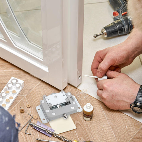Installation of Door Sliders For Wardrobe And Cabinet With Damping Pulley System, tools and parts on wooden floor