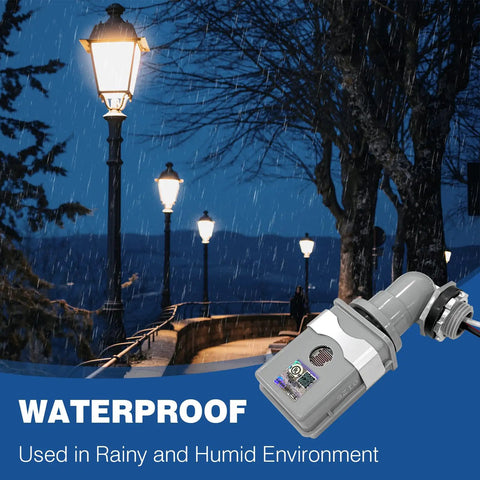 Outdoor Photoelectric Sensor Switch With Auto On At Dusk Off At Dawn installed near street lights in rain, showing waterproof use.