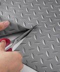 Heavy Duty Red PVC Garage Floor Mat Roll 1.5x2m Cuttable being cut with scissors