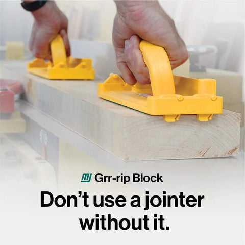 Using GRR-RIP-BLOCK Smart Push Block on wood for safe jointer cuts. Visible: yellow handle, grip pads.