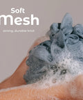 Set of 3 Soft Mesh Bath Shower Loofah Sponges Pouf Body Scrubbers For Gentle Exfoliation And Deep Cleanse With Spa Quality Feel Airy Blossom Color Premium, shown in use.