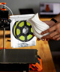 Moisture-Proof 3D Printing Filament Dryer Box with Built-In Desiccant shown beside a 3D printed vase for hobbyists and pros.