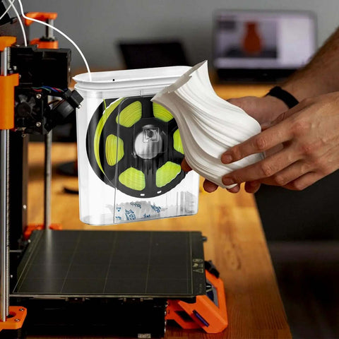Moisture-Proof 3D Printing Filament Dryer Box with Built-In Desiccant shown beside a 3D printed vase for hobbyists and pros.