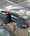 Heavy Duty Electric Strapping Machine With 4000 Mah Battery Powered Handheld Baler Tool For 1/2 To 5/8 Inch Steel Strap close-up view in a warehouse.