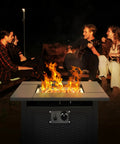 28 Inch Fire Pit Table With 50000 BTU Propane Patio Heater in use during backyard hangout with friends around it at night.