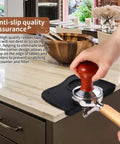 Barista using tamper on Espresso Knock Box And Tamper Mat Set For Baristas with Removable Knock Bar on kitchen counter.