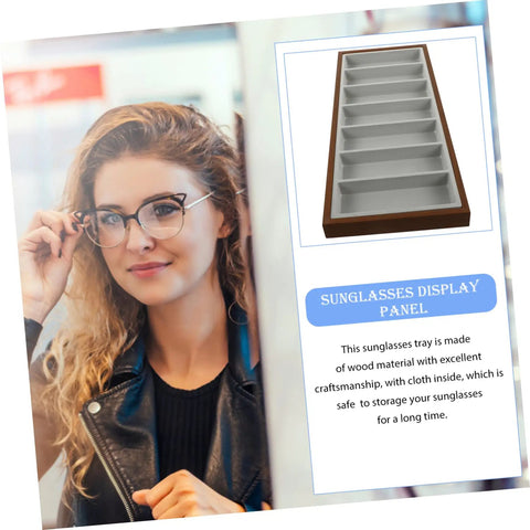 Slick Wooden Sunglasses Display Plate Featuring Seven Grid Slots For Eyeglasses Organization on display with model, showing stylish design.