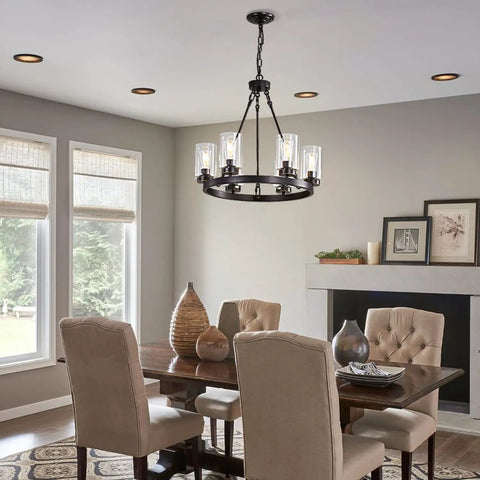 Dining room with Six Light Industrial Rustic Farmhouse Wagon Wheel Chandelier In Black Metal With Clear Glass Shades