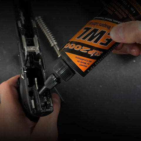 Extreme Weapons Lube CLP Gun Lube And Cleaner Synthetic Gun Lubricant With Anti Wear Additive For Duty And Hobby Firearms 1 Oz Squeeze Bottle Keeps Metal Surfaces Slick And Protected For Range Ready Performance, applying to handgun slide