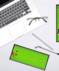 Golf Pen Desktop Game For The Office Hilarious Gift For Golf Lovers, Coworkers, And Bosses on a desk with laptop and coffee.