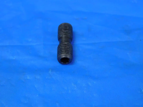 Close-up view of Straight Up 1/4 28 Differential Screw Stainless Steel Flat Head Fully Threaded Right Hand Lock Pin.