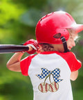 Child wearing a baseball-themed shirt with 10 Pack Baseball DTF Iron On Transfers For T Shirts And Apparel Ready To Press Heat Transfer Sheets.