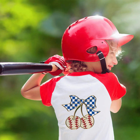 Child wearing a baseball-themed shirt with 10 Pack Baseball DTF Iron On Transfers For T Shirts And Apparel Ready To Press Heat Transfer Sheets.