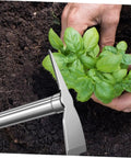 Gardener using Stainless Steel Garden Hoe for Raised Beds Easy To Use Weeding Tool With Grippy Handle Durable Pickaxe Style Hoe near plants