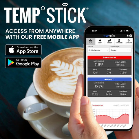 Person holding phone with Remote WiFi Temperature And Humidity Sensor With Data Logger app near coffee cup.