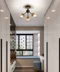 Modern hallway with 3 Light Vintage Semi Flush Mount Glass Globe Chandelier in black finish, featuring smoked glass shades.