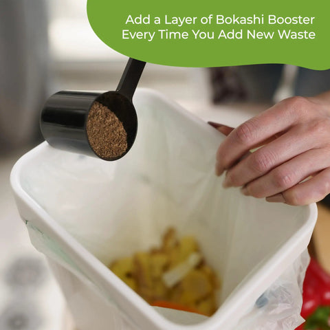 Person adding Bokashi Booster For Indoor Home Composting Buckets And Tumblers Easy For Beginners Microorganisms Fermentation 32 Oz Made In USA Great For All Compost Starters And Rotating Kits to kitchen scraps