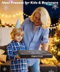 Child receiving Portable Roll Up Electric Drum Kit With 9 Pads And Dual Stereo Speakers Bluetooth MIDI Practice Ready