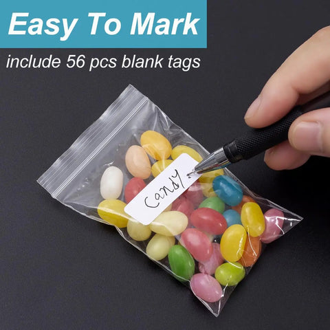 Hand writing on blank tag attached to Clear Zip Bags 4 By 6 Inch Pack Of 200 Reclosable Plastic Bags 2 Mil Thick Food Grade Safe Mini Baggies.
