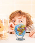 Child reaching for cookies beside Dope Rotating World Globe With Stand For Adults Educational Decorative Tellurian Ball Smooth Spin