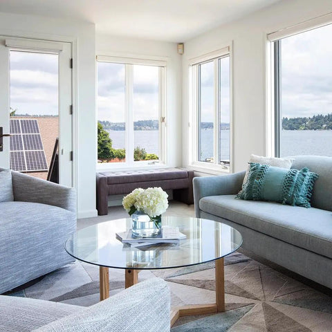 Modern living room with Round 29 Inch Clear Tempered Glass Table Top Replacement With Flat Polished Edge on wooden base.