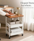 Three Tier Rolling Side Table With Lockable Casters And Spacious Storage Shelves for hassle free room to room moving with a book and decor.