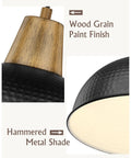 Close-up of Black Pendant Light For Kitchen Island With Hammered Metal Shade, 10.2 Inch One Light Farmhouse Industrial Hanging Lamp showing wood grain finish and hammered texture.