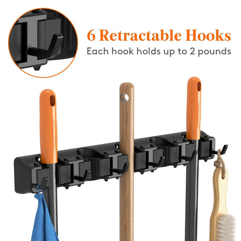 Mop and Broom Holder Wall Mount Anti Slip Hanger for Cleaning Supplies Organizer with 5 slots and 6 hooks, black, installed view.