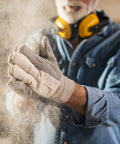 Man in workshop with dust particles, wearing gloves and earmuffs, Automatic Vacuum Switch For Two Tool Setup With Seven-Second Delay