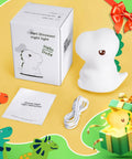 Totally Adorable Dino Night Light For Kids 3 To 8 with box, cord, and instructions displayed. Sixteen color dimmable silicone design.