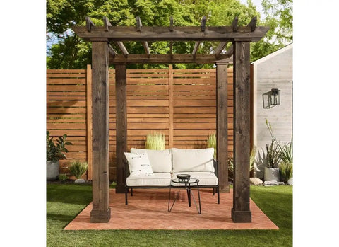 Wooden pergola over outdoor seating with fence, illustrating use of Exterior Stain Semi Transparent Oil Based Neutral Base One Gallon.